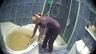 A guy fucks his sexy blonde girlfriend in the bathroom