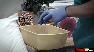 Doctor gives patient a sponge bath and vaginal probe
