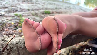 My Cute Feet in Nude Tights Rub Against Each Other on the Autumn River Bank