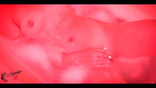 A Girl with an Excellent Figure Has Fun in the Bathroom with a Dildo