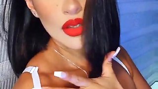 Close up video of a solo brunette with natural tits having fun