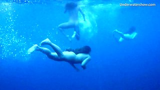 Luscious honeys love undressing while diving in the water