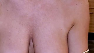 Brunette seductress working her big boobs and hot ass