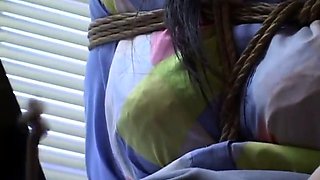 Japanese girl rope bound gives blowjob