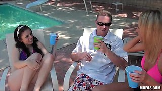 Tattooed dark haired & her huge boobed blonde girlfriend start a poolside group sex