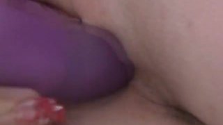 Blonde pregnant slut masturbating using purple dildo