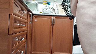 Stepmom masturbates with sex toys in the kitchen