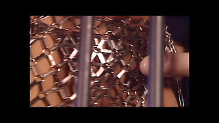 Two Beautiful Young Vintage Lesbians with Strapon in a Cage