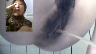 Pissing on toilet gal