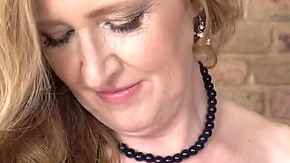 Pretty Mature MILF Angelia Masturbates Herself on the Couch