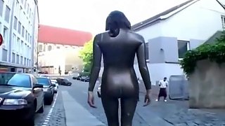 Girl has to walk in latex catsuit on the street because she lost a bet