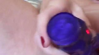 Lily May playing solo on the bed