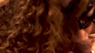 Curly-haired milf swallows cock deep into her throat