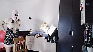 The sexy wife is having fun testing clothes and cuts them. The brunette dances naked around the house.