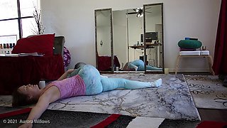 Goddess Aurora Willows does stretching in yoga pants