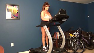 This sexy housewife knows her way around a treadmill and she's got big tits