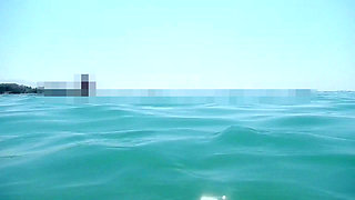 My tits underwater on public beach