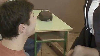 Teacher Rewards His Students at the Desk