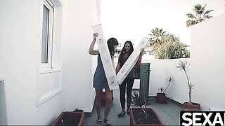 Emylia Argan and Anna Rose sunny balcony with white boxes
