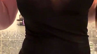 Young stepmom with big tits fucks a dildo in the bathroom