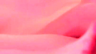 Short-haired blonde Emily masturbates on the bed