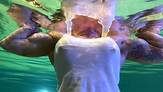 Amazon Kandy Flexes Her Massive Biceps in Her Hotel Pool
