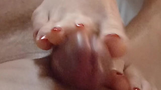 Kelly Performs a Technical Footjob Bringing Dominik's Cock to a Squirting Orgasm.