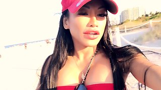 Busty babe playing with her big boobs