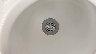 Moaning daddy has a lot of pressure and milks his cock in the public toilet
