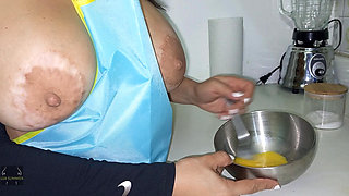 Big-bootied housewife invites her neighbor over and gives him a blowjob in the kitchen