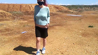 Girl undresses on a windy day