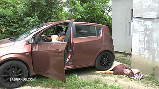 Mistress Jenna Stands on the Slave with a Car While Smoking in the Slave's Mouth